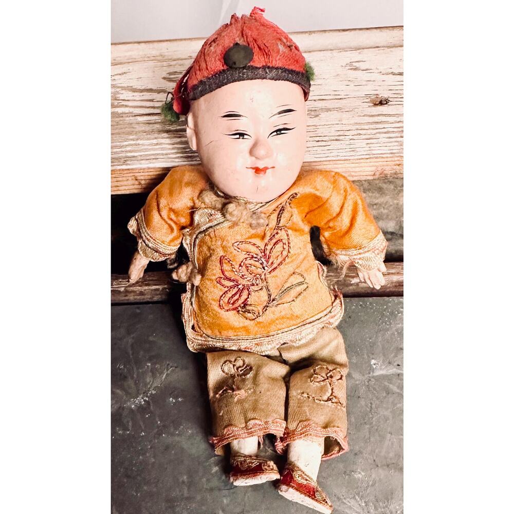 Antique Asian boy doll.